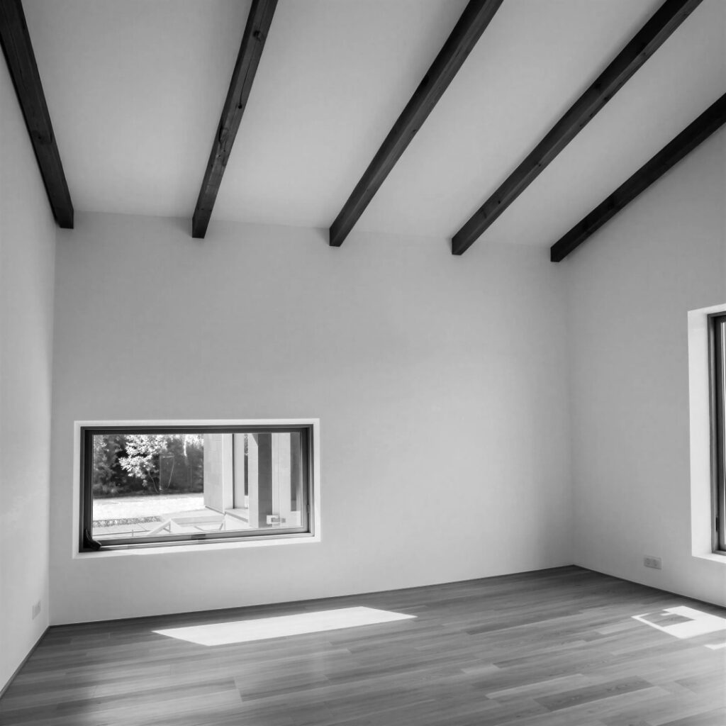 Low garden facing window in art studio